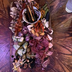 Edge of the Universe - Their charcuterie boards are amazing and delicious. I thought a little pricey but this place is worth the experience.
