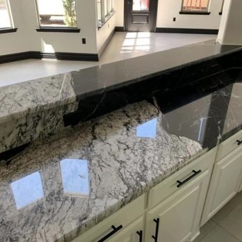 Guerrero Granite - a kitchen counter with a black granite top - Countertop Installation Near Me Guerrero Granite - a kitchen counter with a black granite top - Countertop Installation Near Me
