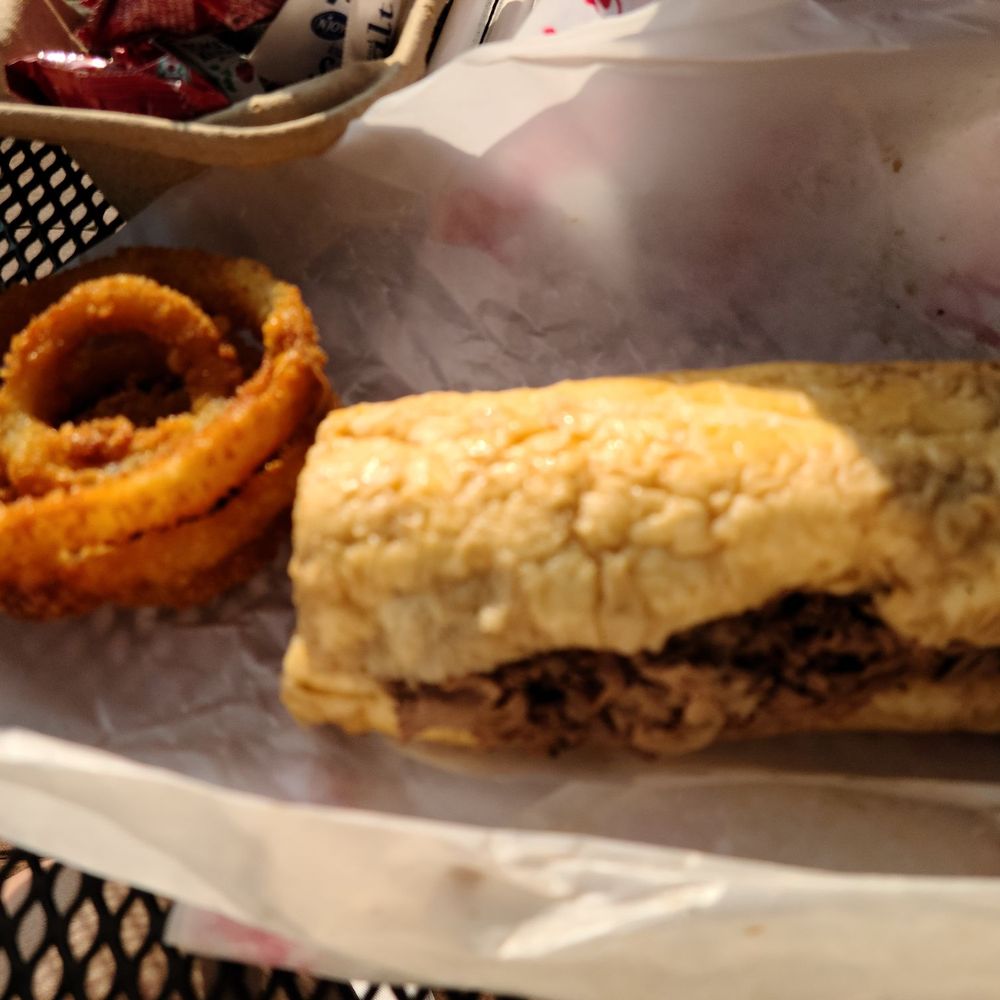 Italian beef and sausage combo served dipped and onion rings Italian beef and sausage combo served dipped and onion rings