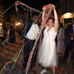 M2M Weddings - A fun wedding reception moment in Washington, DC, capturing the energy and celebration as guests joined the couple for a festive send-off.