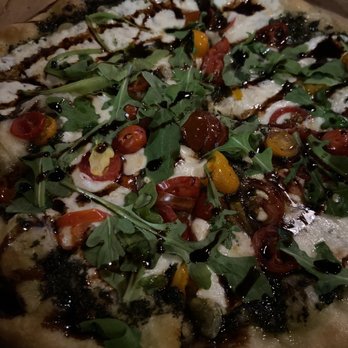 The Place - Arugula pizza minus pancetta but added cherry tomatoes. (Mozzarella, pesto, arugula, and a truffle balsamic glaze - Burgers Near Me - San Juan, Puerto Rico The Place - Arugula pizza minus pancetta but added cherry tomatoes. (Mozzarella, pesto, arugula, and a truffle balsamic glaze - Burgers Near Me - San Juan, Puerto Rico