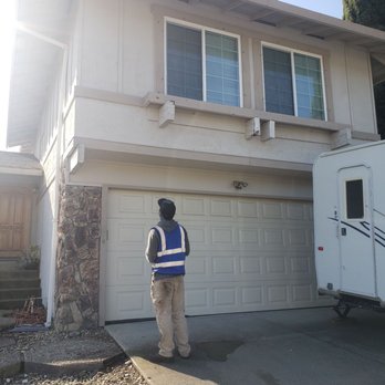 Exterior Touch Pressure Washing - The technician explaining that he patched the gutter because he found a whole. - Pressure Washers Near Me