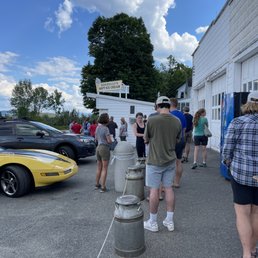 people standing around a fire hydrant