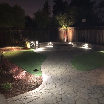 Meza Landscaping - Backyard fire pit with lighting - Landscaping Near Me