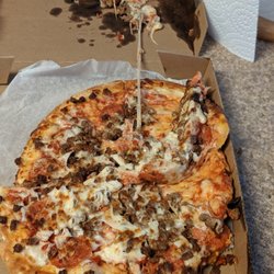 This is what happens when the delivery driver carries the pizza right side up.  When you call the store, no apology. (UPDATE 9/27 no refund)