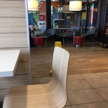 McDonald's - a chair and table in a restaurant - Burgers Near Me - Germantown, Wisconsin McDonald's - a chair and table in a restaurant - Burgers Near Me - Germantown, Wisconsin