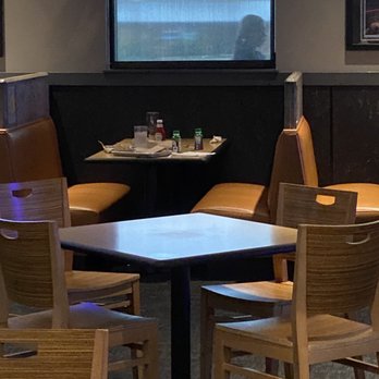 Buffalo Wild Wings - a table and chairs in a restaurant - American Near Me - Anderson, Indiana