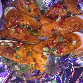 Agit - Spicy baked mussels (minus 1 b/c I couldn't wait) - Bars Near Me - Niles, Illinois Agit - Spicy baked mussels (minus 1 b/c I couldn't wait) - Bars Near Me - Niles, Illinois