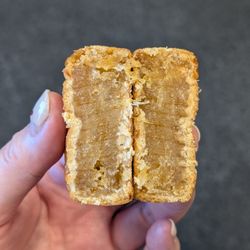 Wai Tack Kee - Cross-section of my mini pineapple mooncake. I used a plastic knife at work to saw through it, which made those fine lines. =)