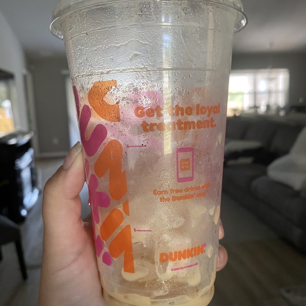 Dunkin' -  a hand holding a cup of drink - Donuts Near Me - Punta Gorda, Florida