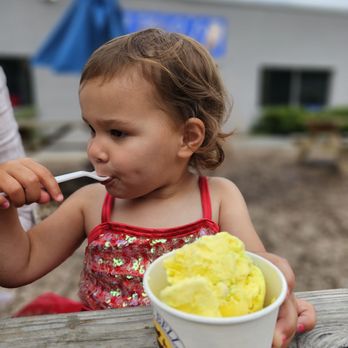 Ozzie's Ice Cream - Beautiful granddaughter enjoying her ice cream - Ice Cream & Frozen Yogurt Near Me - Greensboro, North Carolina Ozzie's Ice Cream - Beautiful granddaughter enjoying her ice cream - Ice Cream & Frozen Yogurt Near Me - Greensboro, North Carolina