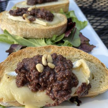 Indigo Moon - Mission fig and Kalamata olive tapenade with baked Brie crostini - New American Near Me - Cambria, California Indigo Moon - Mission fig and Kalamata olive tapenade with baked Brie crostini - New American Near Me - Cambria, California