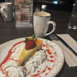 Last night in Hāna, April 2026, Mango cheesecake & cup of coconut/macadamia coffee
