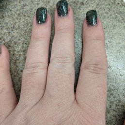 The manicure I got, which I absolutely love. Dark green sparkly nails. The manicure I got, which I absolutely love. Dark green sparkly nails.