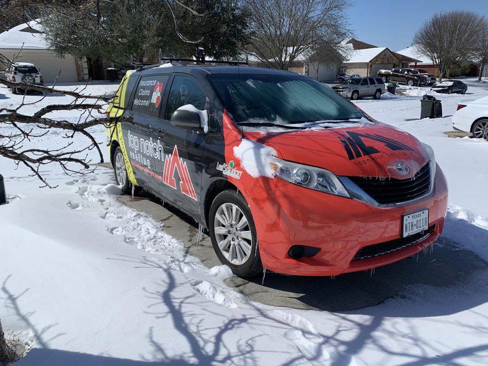 Slide of Top Notch Roofing