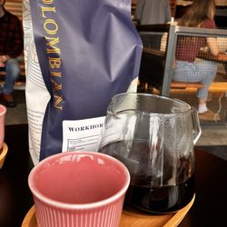 The Colombian - Coffee bags (for purchase) and coffee served.
