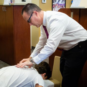 Community Chiropractic Care - Dr. McEvoy checking for Spinal Misalignments - Chiropractors Near Me - Deer Park, New York