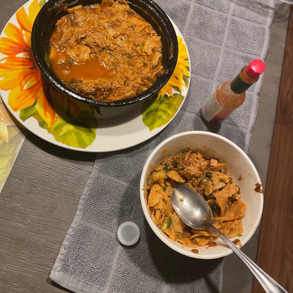 a bowl of chili and a bowl of cornflakes on a table a bowl of chili and a bowl of cornflakes on a table