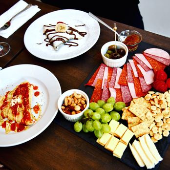 Vin de Paris - a platter of cheese, crackers, grapes, and meats - Wine Bars Near Me - Paris, Texas