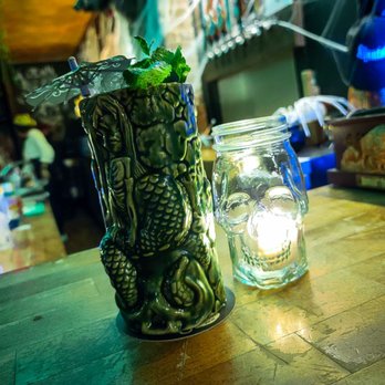 Bar Vintage 132 - a glass vase and a jar of mint - Bars Near Me - Montreal, Quebec