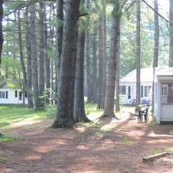 Conway Lakeside Cottages - Pine trees with porch of cottage #3