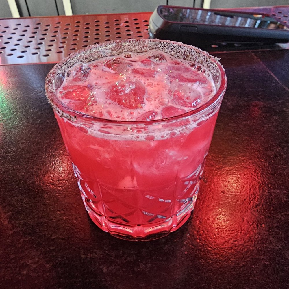 Purple Rain: hibiscus-infused baijiu, green tea simple, Japanese rum, lime, & rhubarb bitters.