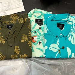 Sig Zane Designs - The shirts are Kahanulaua'e Pullover Aloha Shirt Khaki, Aipononkamoku Button Up Aloha Shirt - Sea Mist, and White Ginger Blossom Button Up