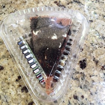 Val's Cheesecakes - Chocolate cheesecake slice with white chocolate, Oreo and ganache - Desserts Near Me - Dallas, Texas