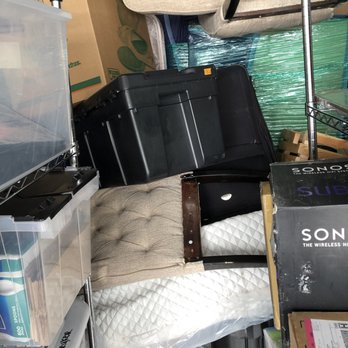 Mighty Titans Moving - Our brand new spring mattress folded in half with random items between and on top of it - Movers Near Me