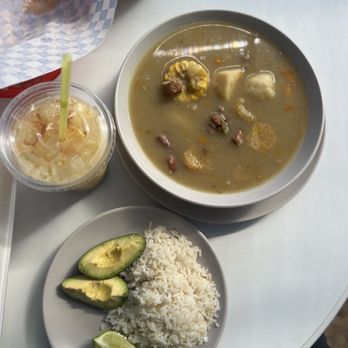 Dominican Delights - Morir Soñando drink, sancocho with rice, avocado, and lime. - Food Trucks Near Me - Austin, Texas Dominican Delights - Morir Soñando drink, sancocho with rice, avocado, and lime. - Food Trucks Near Me - Austin, Texas