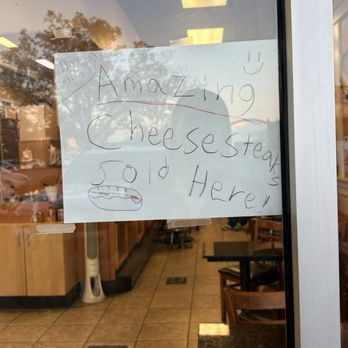 Cheesesteak & Grill Stop - Cute sign in window - Chicken Wings Near Me - Folsom, California