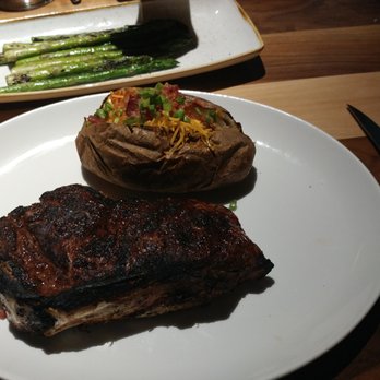 Remington's - Aged steak with loaded potato - American Near Me - Chicago, Illinois Remington's - Aged steak with loaded potato - American Near Me - Chicago, Illinois
