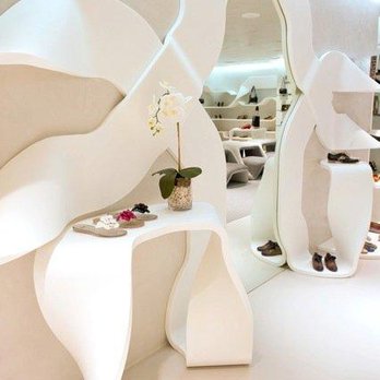 Mikron Design - a white room with a curved shelf and a mirror - General Contractors Near Me - Lake Zurich, Illinois