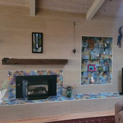 Completely Custom Tile - Custom fireplace wall with build in tiled niche and tiled base