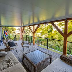 MasterDecks by People Come First Construction Group - Seattle TimberTech composite deck with two-tone Coastline & Dark Hickory boards, cable railing, switchback stairs, and an undercover system.