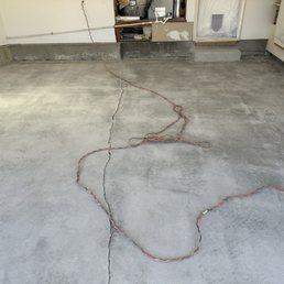 After grinding down the floor. Perfectly smooth & level. He also widened the crack so he could fill it in properly. After grinding down the floor. Perfectly smooth & level. He also widened the crack so he could fill it in properly.