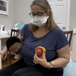 Atlanta Lactation - Katherine demonstrating how to hold the breast in preparation of latching baby.