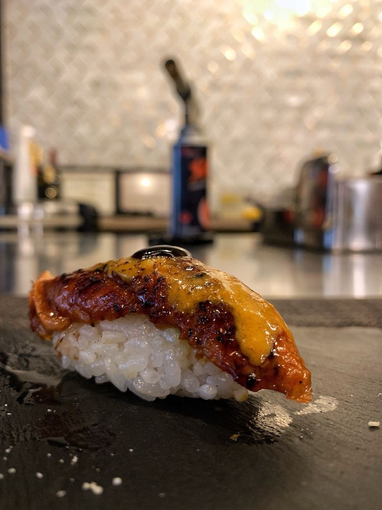 Nakama Japanese Cuisines & Omakase Logo