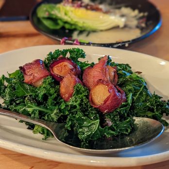 Black Bottle - Bacon-wrapped scallops on a bed of kale - New American Near Me - Seattle, Washington