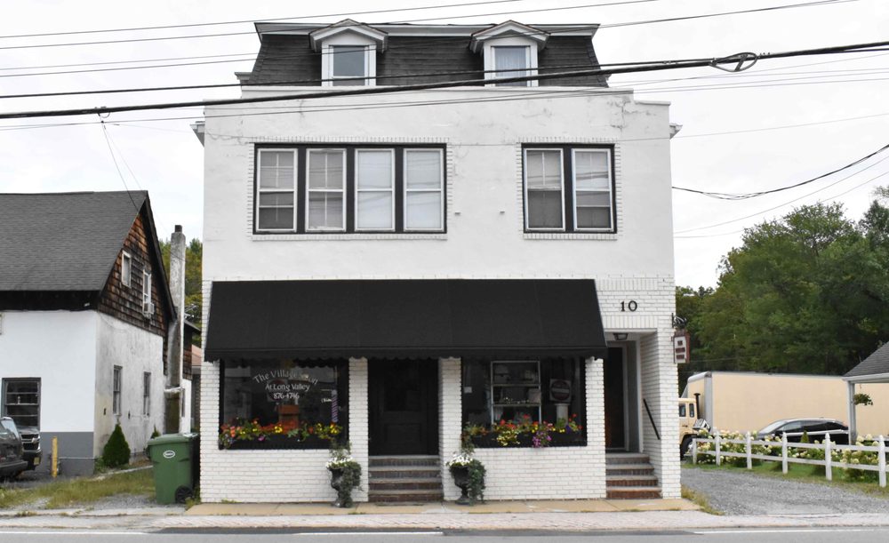 The Village Salon & Boutique at Long Valley Logo