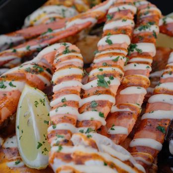 The Raider claw - a tray of lobster with a lemon wedge - Food Trucks Near Me - Las Vegas, Nevada The Raider claw - a tray of lobster with a lemon wedge - Food Trucks Near Me - Las Vegas, Nevada