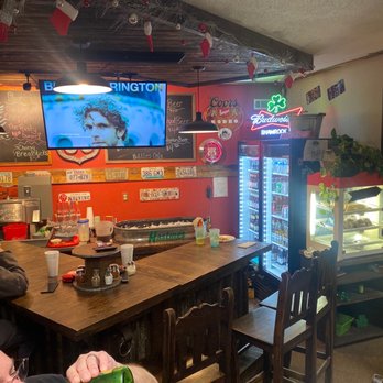 Rusty's - a man drinking a beer in a bar - Burgers Near Me - Shamrock, Texas Rusty's - a man drinking a beer in a bar - Burgers Near Me - Shamrock, Texas