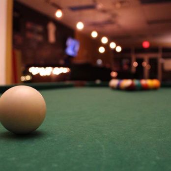 Kavakaze - a pool table with a ball on it - Bars Near Me - Tallahassee, Florida