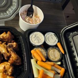 Smoked chicken wings, coleslaw and carrots and celery with blue cheese that is fantastic and ranch