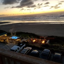 My view from the balcony to my room. You can see the heated infinity pool and the fire pits. The gate for the beach is just beyond them.