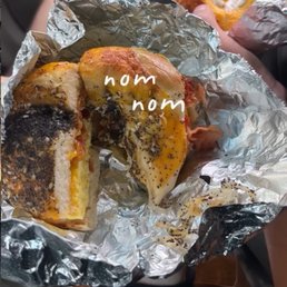 top: bacon egg and cheese + cream cheese on a jalapeño cheese bagel bottom: bacon egg and cheese on an everything cheese bagel top: bacon egg and cheese + cream cheese on a jalapeño cheese bagel bottom: bacon egg and cheese on an everything cheese bagel
