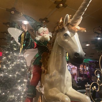 Bacchus House Wine Bar & Bistro - Unhinged Christmas elf man riding unicorn decor - New American Near Me - Folsom, California Bacchus House Wine Bar & Bistro - Unhinged Christmas elf man riding unicorn decor - New American Near Me - Folsom, California