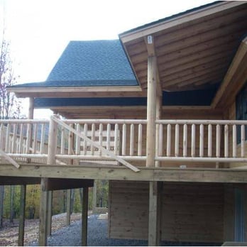 Oak Contracting & Design - a view of a log home - General Contractors Near Me