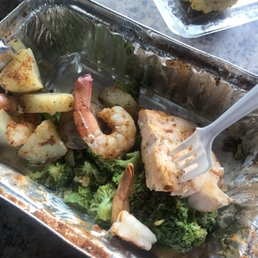 Salmon shrimp n veggies heavy seasoned with Idk but he said it oldbay Salmon shrimp n veggies heavy seasoned with Idk but he said it oldbay