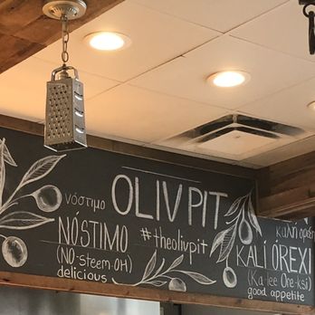 Oliv Pit - Learning Greek... sign over the open kitchen - Greek Near Me - Boca Raton, Florida Oliv Pit - Learning Greek... sign over the open kitchen - Greek Near Me - Boca Raton, Florida